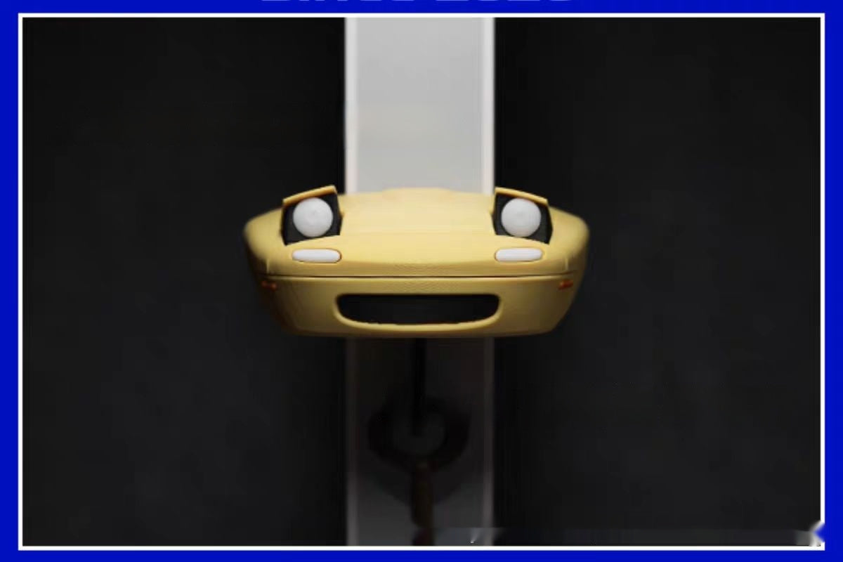 Auto-Schlüsselanhänger mit offenem Scheinwerfer als Dekoration